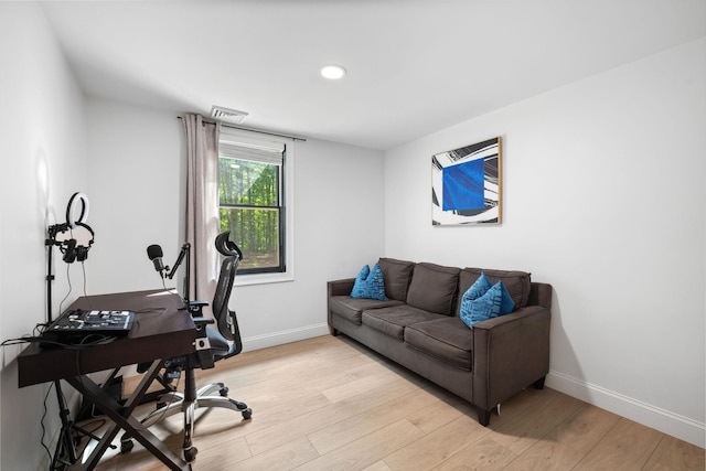 office space with light wood-type flooring