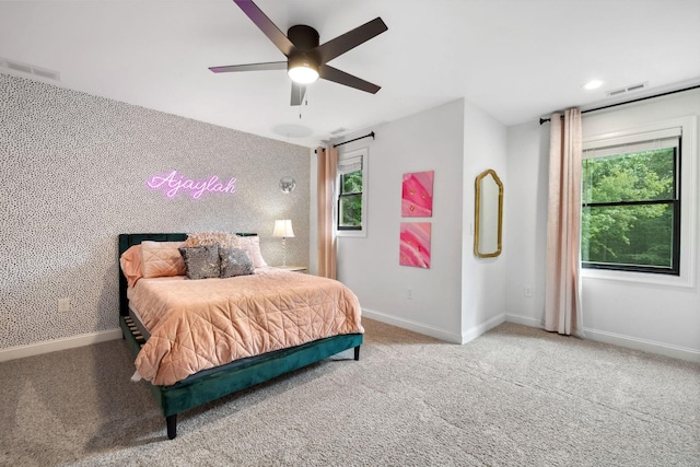 carpeted bedroom featuring ceiling fan