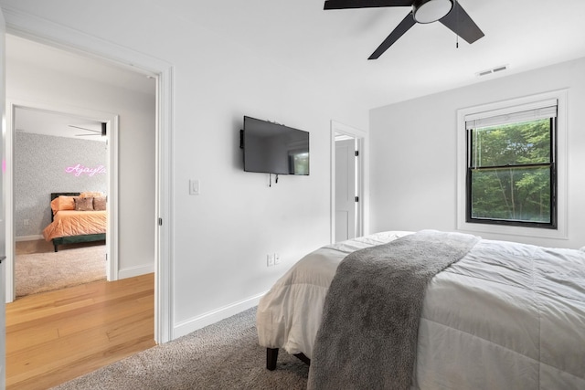 bedroom featuring ceiling fan and light hardwood / wood-style floors