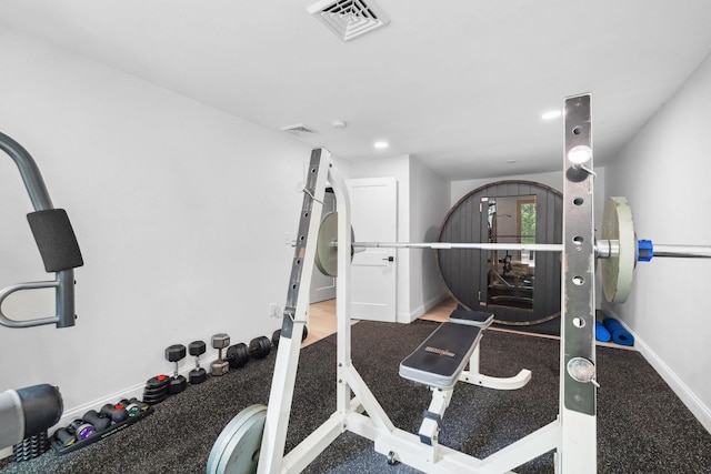 workout area with wood-type flooring