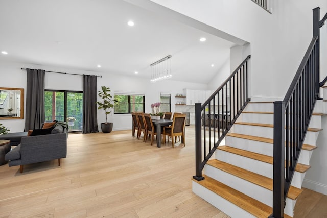 stairway with light wood-type flooring