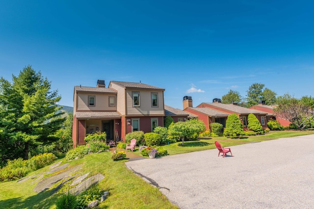 view of front of home with a front yard