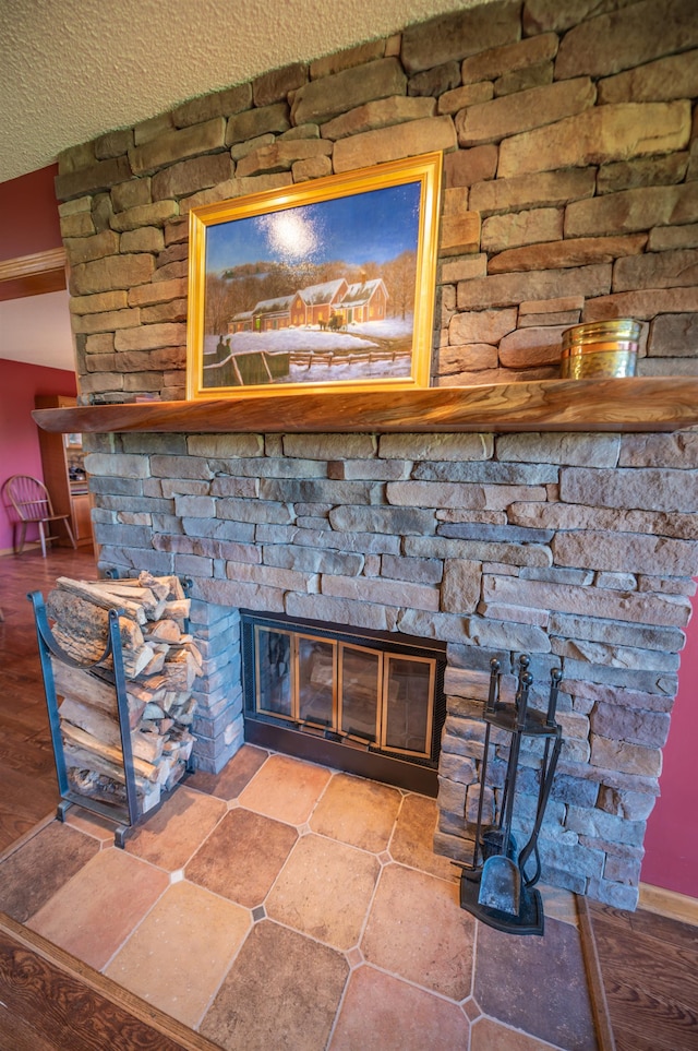 interior details with a fireplace and a textured ceiling