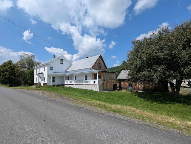 2454 W Barnet Rd, Barnet, VT 05821 - view of side of property with a yard and metal roof