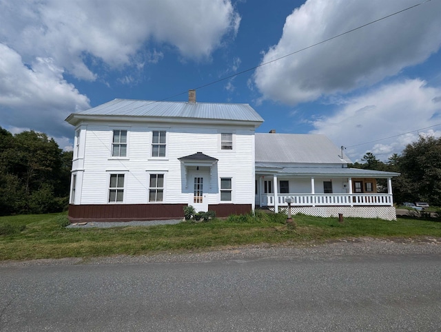 2454 W Barnet Rd, Barnet, VT 05821 - view of front of property with metal roof, covered porch, and a chimney