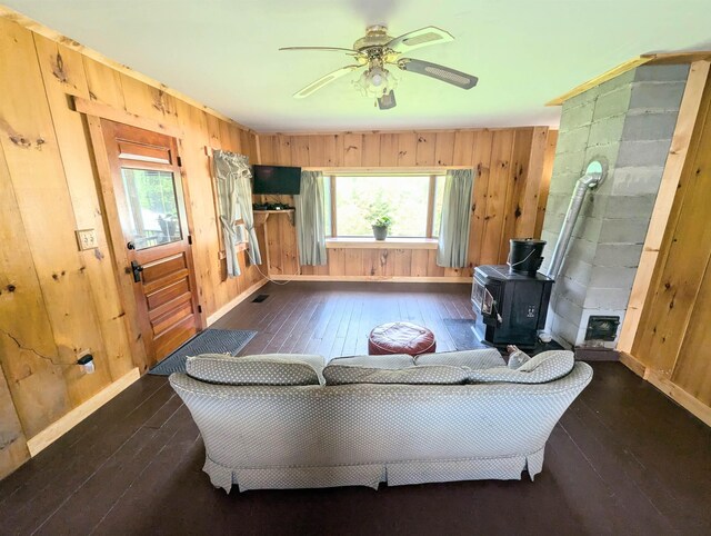 2454 W Barnet Rd, Barnet, VT 05821 - living room with hardwood / wood-style flooring, baseboards, wood walls, and healthy amount of natural light