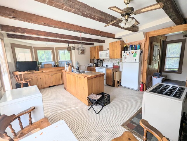2454 W Barnet Rd, Barnet, VT 05821 - kitchen with white appliances, a sink, beamed ceiling, ceiling fan, and tasteful backsplash