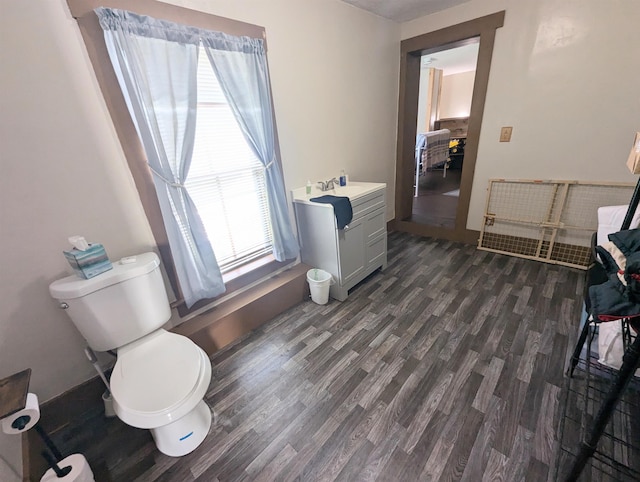 2454 W Barnet Rd, Barnet, VT 05821 - bathroom featuring wood finished floors, toilet, and a sink