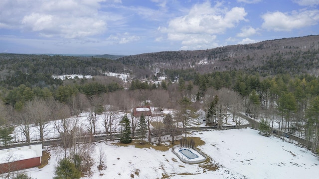 exterior space featuring a wooded view