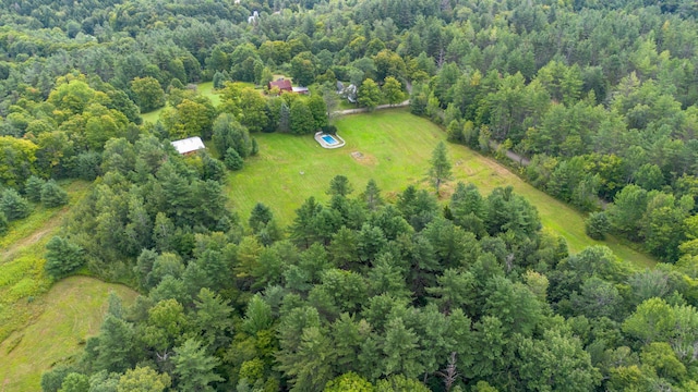 drone / aerial view featuring a forest view