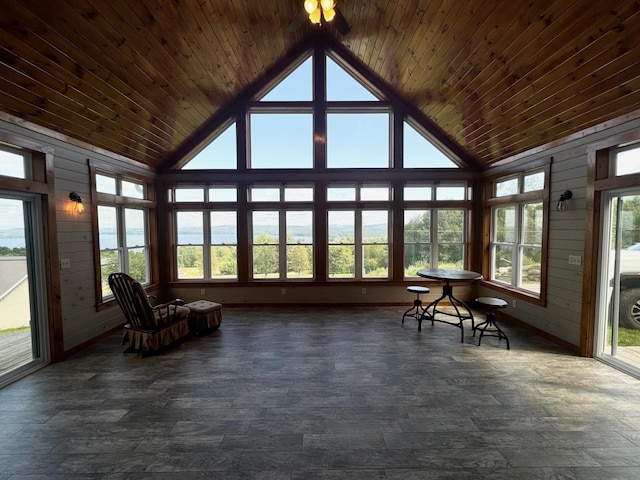 unfurnished sunroom with wood ceiling and vaulted ceiling