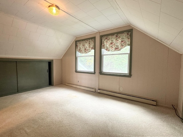 bonus room featuring carpet, lofted ceiling, and a baseboard radiator