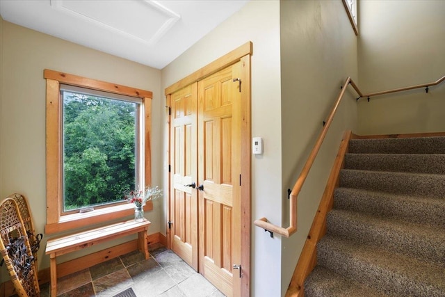 entryway with tile patterned floors