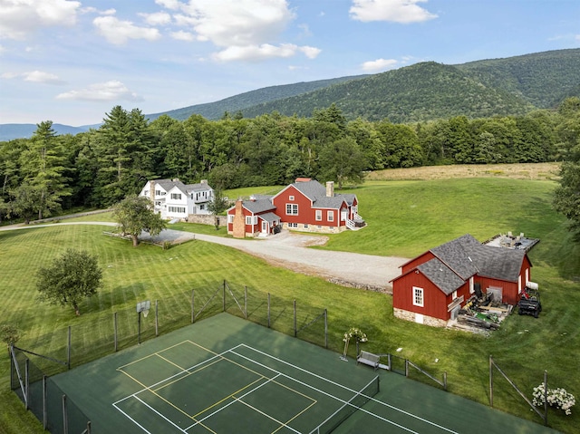 bird's eye view featuring a forest view and a mountain view