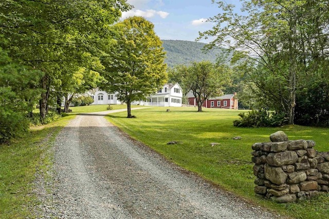 exterior space with driveway and a mountain view