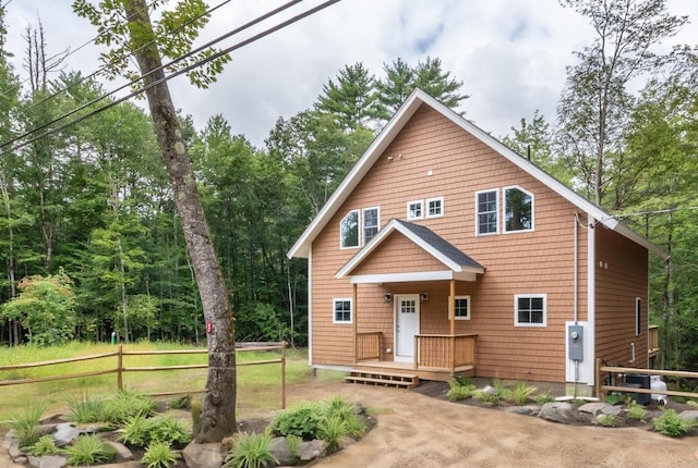 view of front of house featuring fence