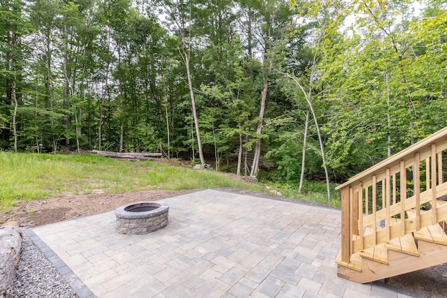 view of patio / terrace with a fire pit