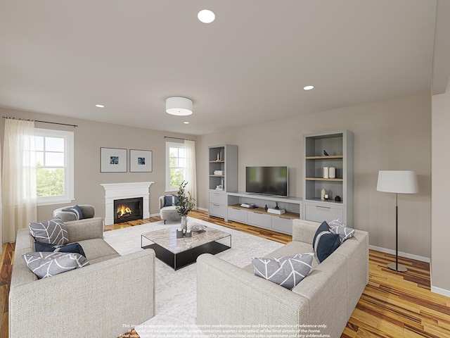 living room featuring a fireplace with flush hearth, recessed lighting, light wood-style flooring, and baseboards