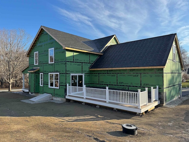 back of property featuring a wooden deck