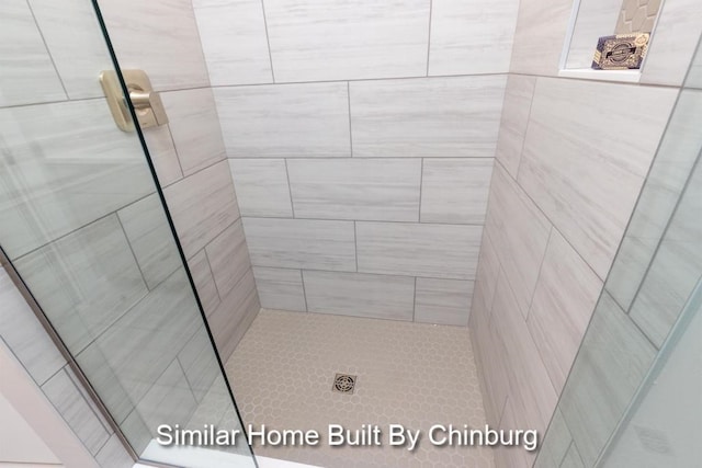 bathroom featuring tiled shower