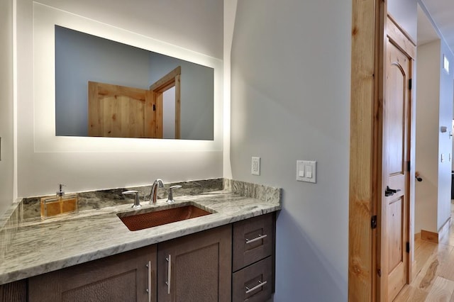 bathroom featuring vanity and wood finished floors