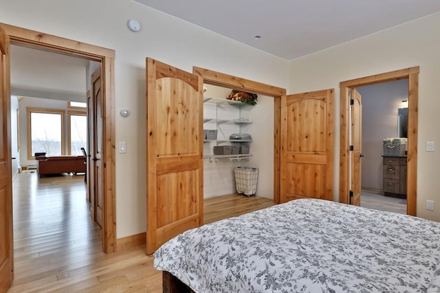 bedroom featuring a closet and light wood-style floors