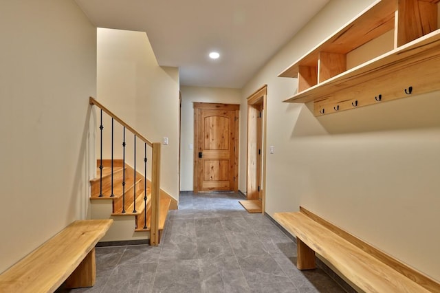 mudroom featuring recessed lighting and baseboards