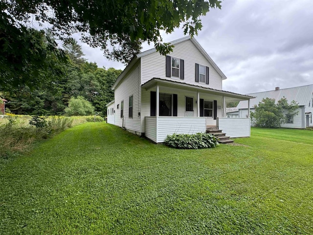 exterior space featuring a yard and covered porch