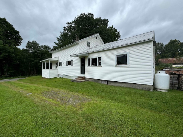 back of house with a yard