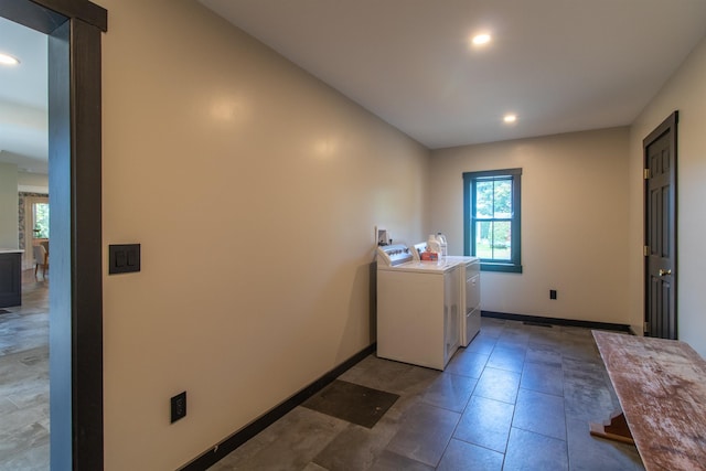 laundry room featuring washer and dryer, laundry area, baseboards, and recessed lighting