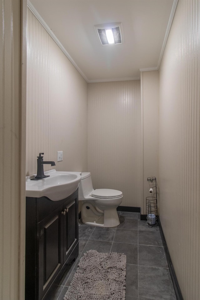 half bath featuring visible vents, toilet, ornamental molding, tile patterned flooring, and vanity