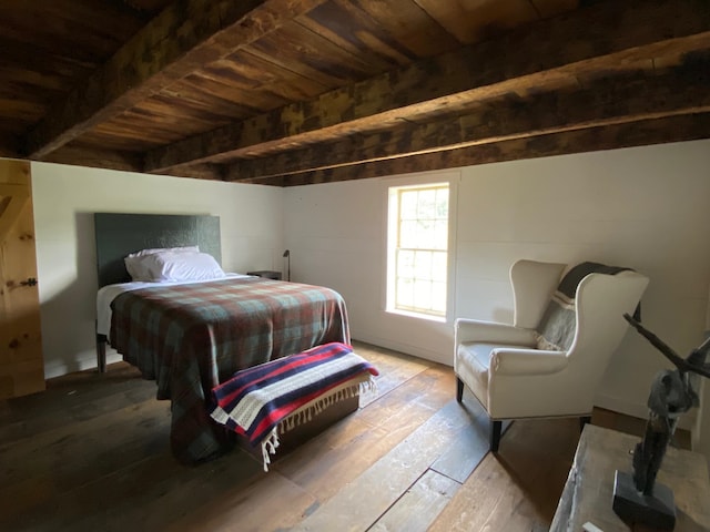 bedroom with wood ceiling, hardwood / wood-style flooring, and beamed ceiling