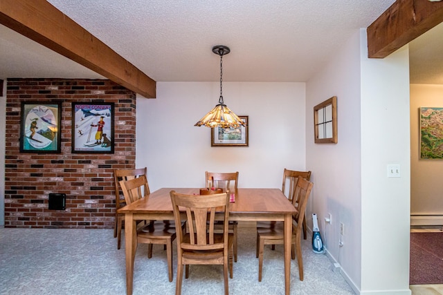 dining area featuring a textured ceiling, a baseboard heating unit, carpet, and beamed ceiling