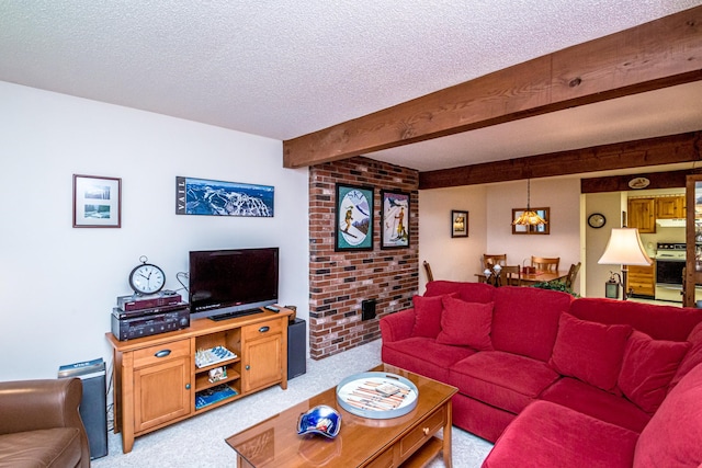 carpeted living room with beamed ceiling and a textured ceiling