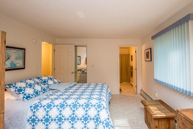 carpeted bedroom featuring a baseboard radiator