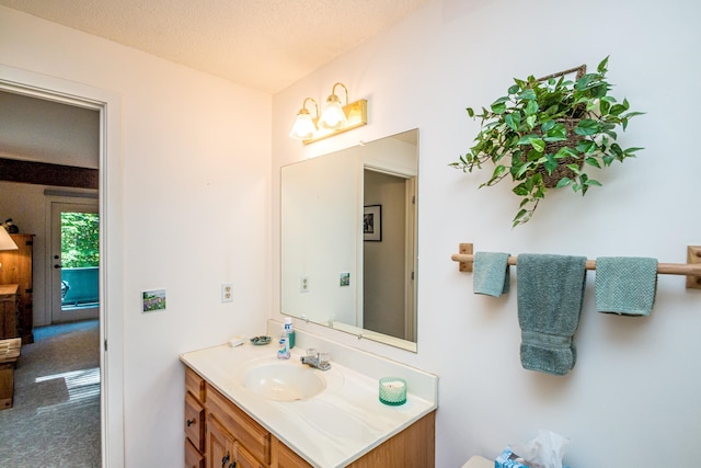 bathroom featuring vanity and a textured ceiling