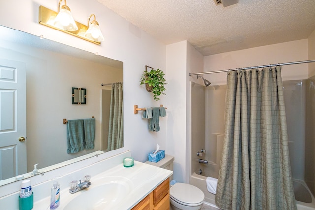 full bathroom with shower / bath combo with shower curtain, a textured ceiling, toilet, and vanity