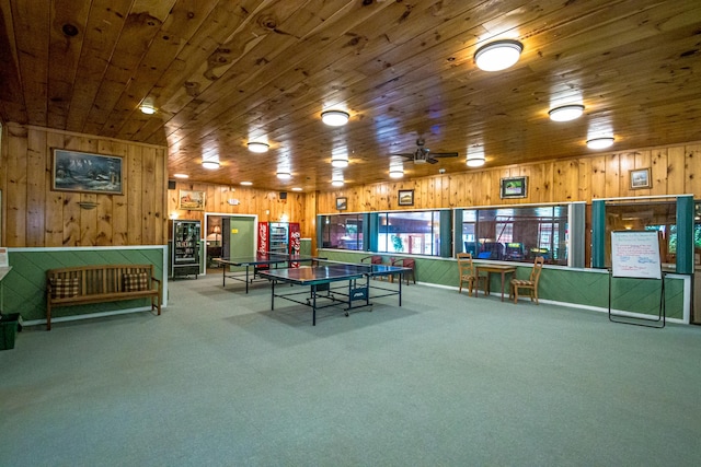 playroom featuring ceiling fan, carpet flooring, and wooden ceiling