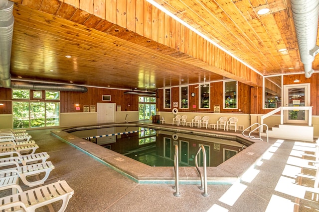 view of pool with an indoor hot tub