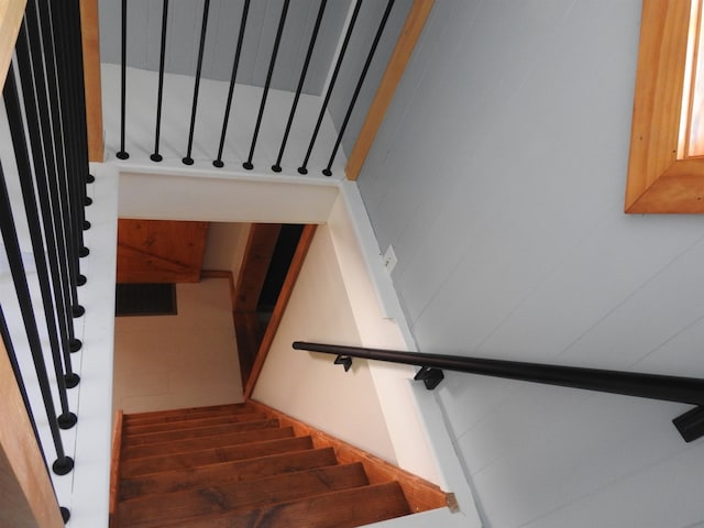 stairs with hardwood / wood-style flooring