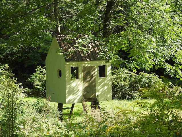 view of home's exterior featuring a storage shed