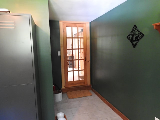 entryway featuring light tile patterned flooring