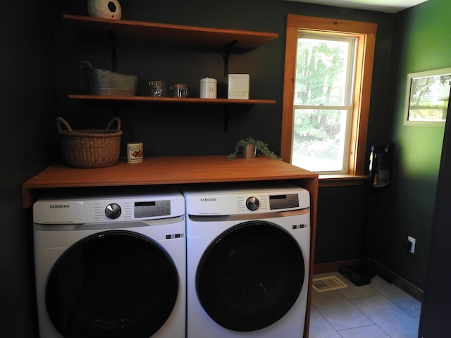 laundry room with a wealth of natural light and separate washer and dryer