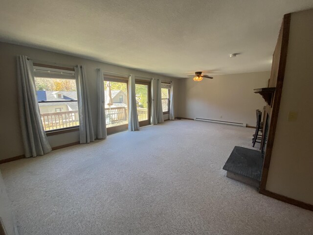 dining space featuring ceiling fan and carpet floors