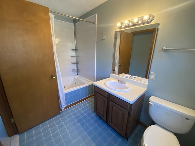 bathroom with tiled shower / bath, toilet, and vanity