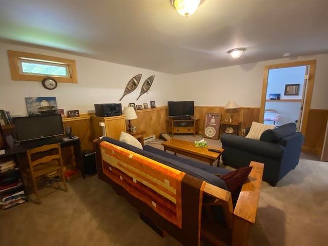 living room with wood walls and carpet floors