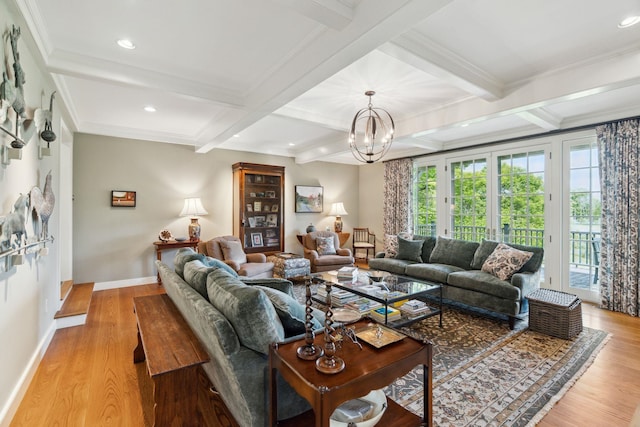 living room with beam ceiling, light hardwood / wood-style floors, and an inviting chandelier