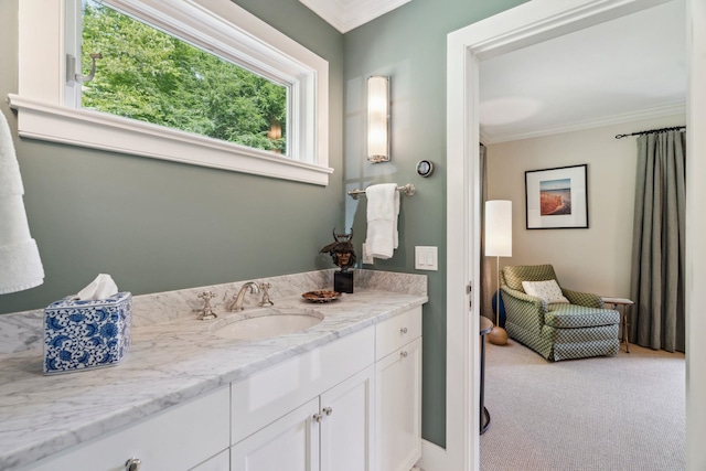 bathroom with vanity and crown molding