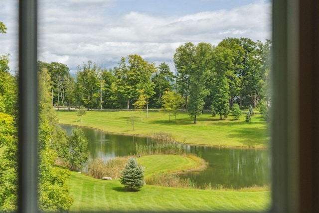 surrounding community featuring a water view and a yard