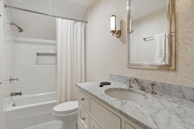 full bathroom with shower / tub combo with curtain, vanity, and toilet